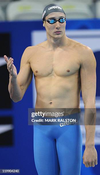 South Africa's Gideon Louw gestures prior to compete in the heats of the men's 100-metre freestyle swimming event in the FINA World Championships at the indoor stadium of the Oriental Sports Center in Shanghai on July 27, 2011.      AFP PHOTO / MARK RALSTON (Photo credit should read MARK RALSTON/AFP via Getty Images)