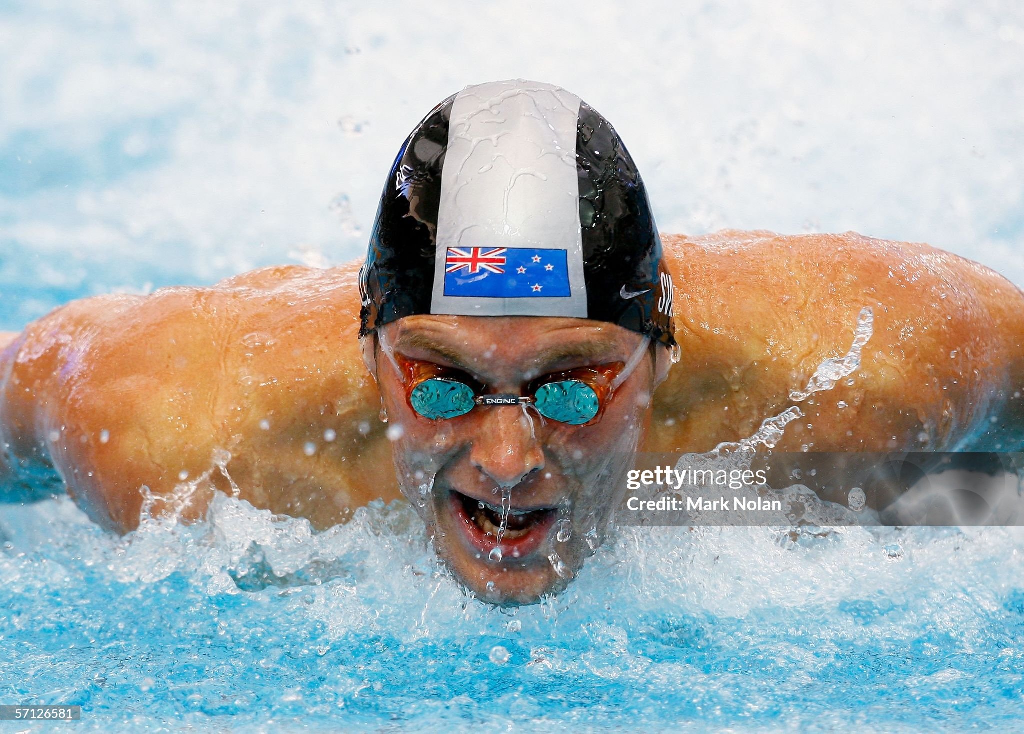 MELBOURNE, AUSTRALIA - MARCH 19: Corney Swanepoel of New Zealand competes in the men's 100m butterfly heats during the swimming at the Melbourne Sports & Aquatic Centre during day four of the Melbourne 2006 Commonwealth Games March 19, 2006 in Melbourne, Australia.  (Photo by Mark Nolan/Getty Images)