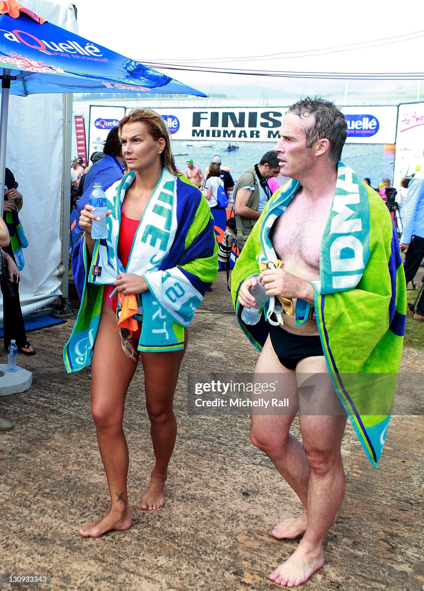 Franziska Van Almsick (L) with Lewis Pugh the extreme cold water swimmer, dubbed the Human Polar Bear, after finishing their race in the Iron Man and Physically Challenged Event of the 2011 aQuelle Midmar Mile Race at Midmar Mile Dam on February 12, 2011 in Pietermaritzburg, South Africa. (Photo by Michelly Rall/WireImage)